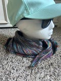 manos del Uruguay hand knitted scarf with self striping yarn using a pattern that creates a rich texture and fabric.