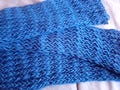 Hand-knitted blue loose knit scarf