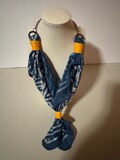 Bandana with chain and clasp.